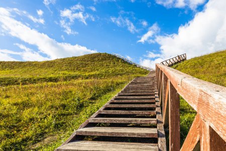 Photo for Wooden stairs going up to the historical mound of Seredzius, Lithuania. - Royalty Free Image
