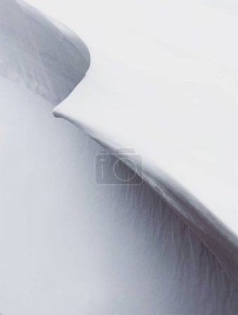 Photo for Close up of the clean snowy lines of a snow drift on a winter day. - Royalty Free Image