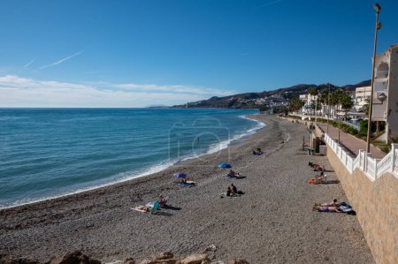 Photo for Nerja, Spain : 2022 November 22 : People in the Beach from Balcon de Europa in the city of Nerja in Malaga, Spain in 2022. - Royalty Free Image
