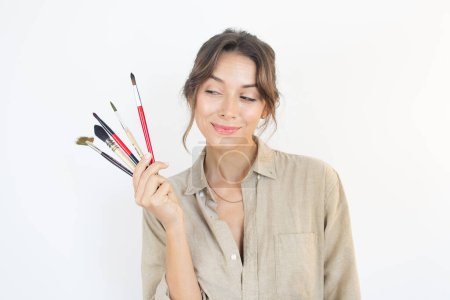 Téléchargez les photos : Person Holding Painting Brushes Artist - en image libre de droit