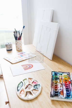 Photo for Desk with Watercolor and Art Materials - Royalty Free Image