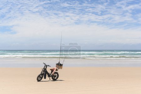 Photo pour Horizontal shot of Motorbike with fishing equipment in a basket - image libre de droit