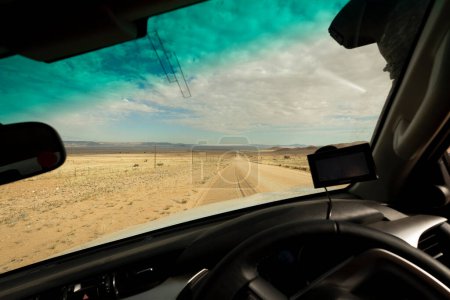 Foto de A desert road as seen from inside of a car in Karas Region, Nami - Imagen libre de derechos