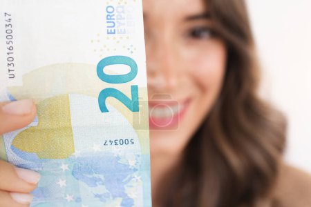 Foto de Earn Money Happy Woman Holding Cash Euro Bill - Imagen libre de derechos