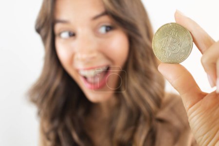 Foto de Earn Crypto Happy Woman Holding Bitcoin - Imagen libre de derechos