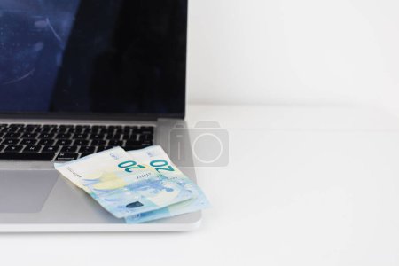 Photo for Earn Money Online Euro Bills on a Laptop - Royalty Free Image