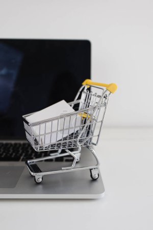 Photo for Shopping Cart on Laptop Ecommerce Online Store - Royalty Free Image