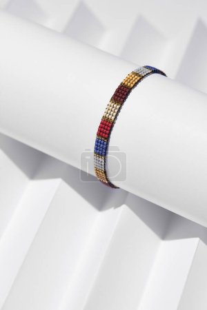 Téléchargez les photos : Handmade Colorful Bracelet on a White Background - en image libre de droit
