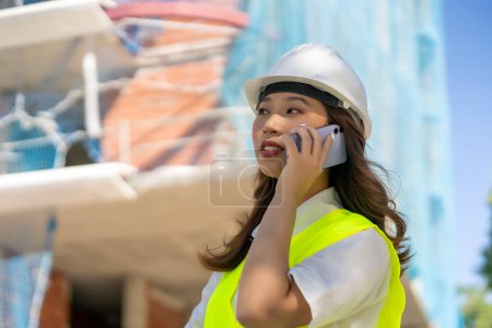 Photo for Female architect having a phone call - Royalty Free Image