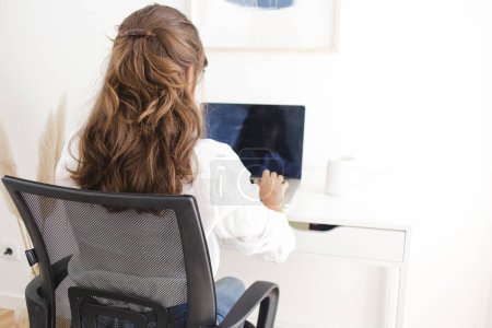 Foto de Woman Working from Home Office on her Desk - Imagen libre de derechos