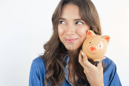 Téléchargez les photos : Woman Holding a Piggy Bank Savings Dreams - en image libre de droit