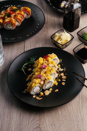 Photo for Sushi rolls with mango and nuts - Royalty Free Image