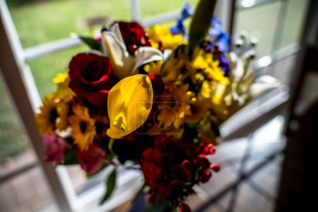 Foto de Colorful Flower Bouquet on Table Near Bright Window - Imagen libre de derechos