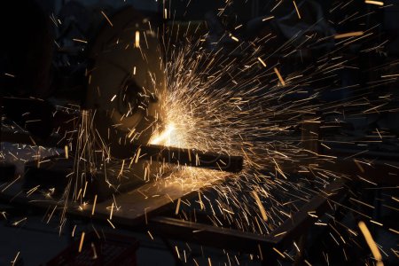 Photo for Sparks from metal. Lots of sparks from grinding steel. - Royalty Free Image