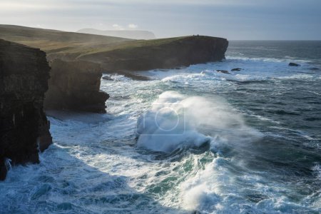 Waves crash into coastal sea cliffs at Yesnaby, Orkney Islands, Scotland