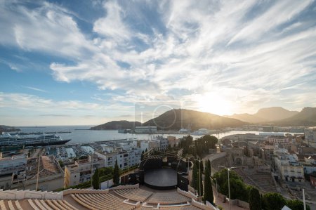 Téléchargez les photos : Cartagena, Spain : 2022 November 23 : Amphitheater and Roman amphitheater in the touristic city of Cartagena with moored boats in the autumn of 2022. - en image libre de droit