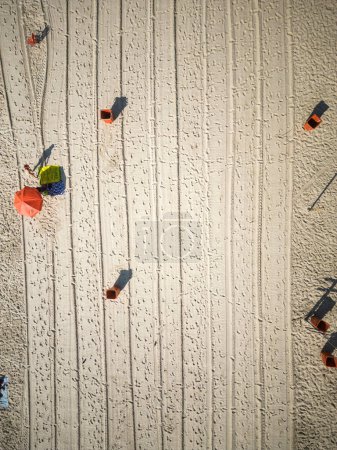 Téléchargez les photos : Top down view to Copacabana beach sand with lines of cleaning vehicle marks, Rio de Janeiro, Brazil - en image libre de droit