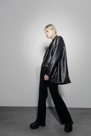 Photo for Natural look. Beauty model woman . Model test portrait with young beautiful fashion model posing on grey background. Blond woman in a black blazer . Natural makeup - Royalty Free Image