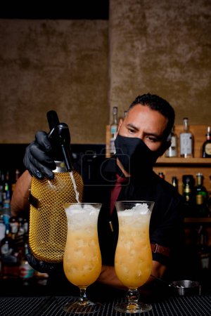 Photo for Bartender preparing cocktail at the cocktail bar. drinks concept - Royalty Free Image