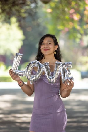Photo for Mexican woman holding love balloon, valentine's day, woman's day, - Royalty Free Image