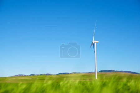 Photo for Wind turbine for electric power production in a prairie. - Royalty Free Image