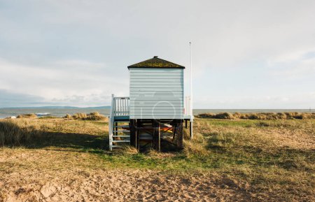 Photo for Beach hut surf station over looking the coastline in England - Royalty Free Image