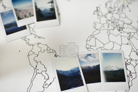 Photo for Polaroid Photos Layout of Mountains on Travel World Map - Royalty Free Image