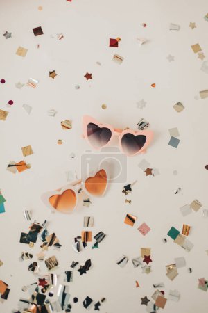 Photo for Valentine's Day Inspiration with Heart Sunglasses and Confetti - Royalty Free Image