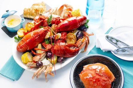 Photo for Atlantic Lobster and Crab Feast with corn and bread - Royalty Free Image
