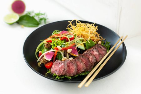 Photo for Protein rich steak salad on a white background - Royalty Free Image