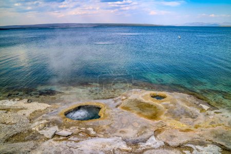 Photo for A geyser, steam and water boils from the ground in the well known preserve national forest - Royalty Free Image