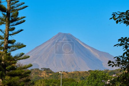 Photo for Colima volcano on a clear day with blue skies - Royalty Free Image