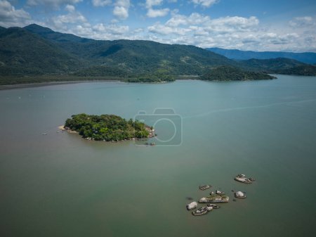 Photo for Beautiful aerial view to green rainforest island on ocean shore small town, Paraty, Rio de Janeiro, Brazil - Royalty Free Image
