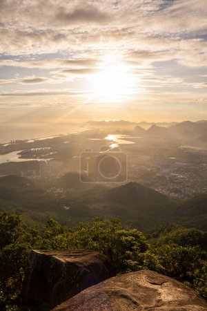 Téléchargez les photos : Beautiful sunset view to city from rainforest mountain in Bico do Papagaio, Tijuca Forest, Rio de Janeiro, Brazil - en image libre de droit