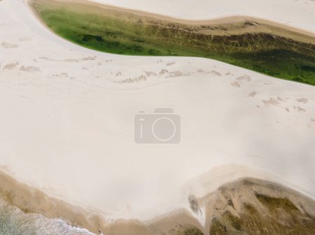 Photo for Beautiful aerial view to white sand dunes and green rainwater pools in Lenis Maranhenses, near Barreirinhas, Maranho, Brazil - Royalty Free Image
