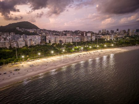 Photo for Beautiful aerial view on sunset time to city buildings, ocean and mountains in Aterro do Flamengo, Rio de Janeiro, Brazil - Royalty Free Image