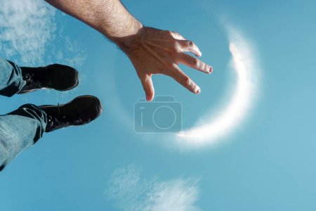 Photo for Senses, hand and feed up in the air playing with the sunlight - Royalty Free Image