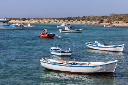 Foto de Colorful boats in blue water on Amorgos, Greek Islands - Imagen libre de derechos