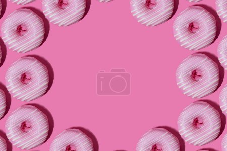 Photo for Raspberry donuts in pink glaze on a pink background. pattern. - Royalty Free Image