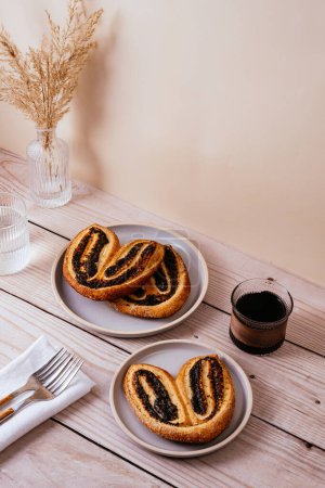 Photo for Homemade puff pastry cookies with poppy seeds - Royalty Free Image