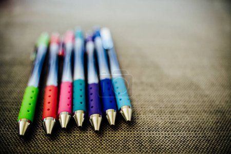 Photo for Colorful Pens Lined up on Table - Royalty Free Image