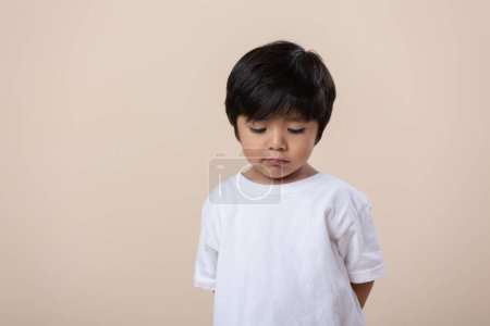 Photo for Scolded or sad little Mexican boy, sad expression - Royalty Free Image