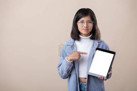 Photo for Portrait of Mexican young girl holding woman showing message on tablet - Royalty Free Image