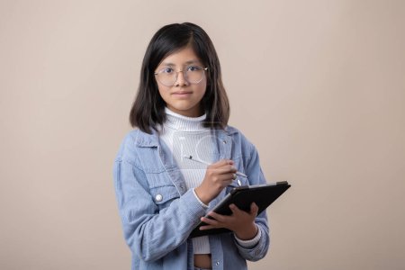 Photo for Portrait of a Mexican young girl with tablet and stylus pen - Royalty Free Image