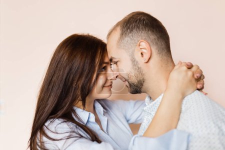 Photo for Man and a woman in love pose for a family portrait - Royalty Free Image