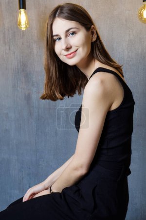 Photo for Portrait of young confident happy woman in studio - Royalty Free Image
