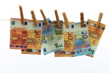 Photo for Euro banknotes hung on a clothesline with clothespins white background for copy space - Royalty Free Image