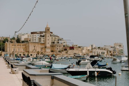 Photo for View of the ancient architecture and docked boats in Marsaskala, Malta - Royalty Free Image