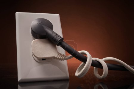 Photo for Electrical outlet with entangled power cords - Royalty Free Image