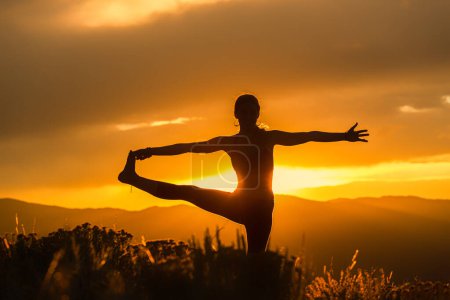 Photo for Carbondale Colorado Yoga Poses at Sunset - Royalty Free Image